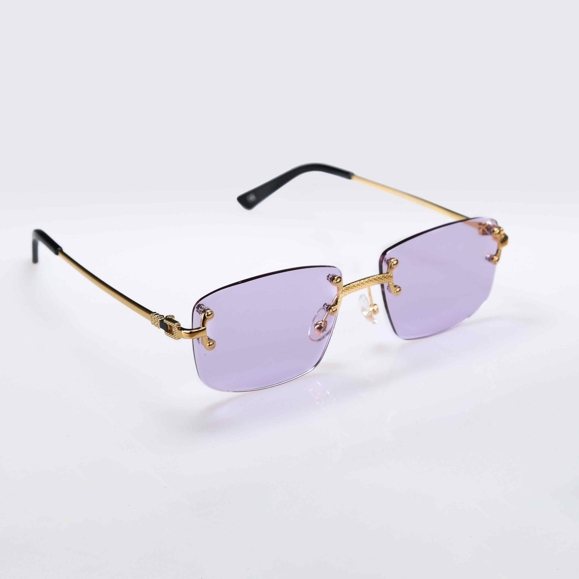 Lunettes de soleil Shine à verres violets clairs et monture dorée. Élégance et confort pour une protection UV quotidienne.