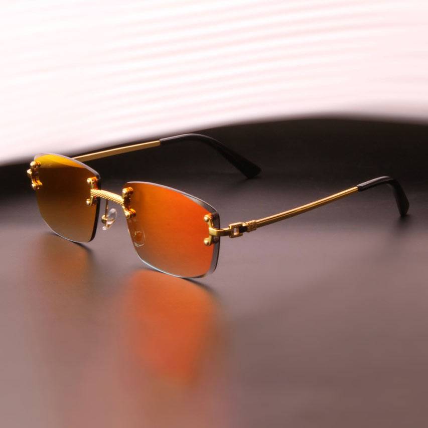 Lunettes de soleil Shine avec verres miroir orange et monture dorée. Style audacieux pour homme avec protection UV intégrée.